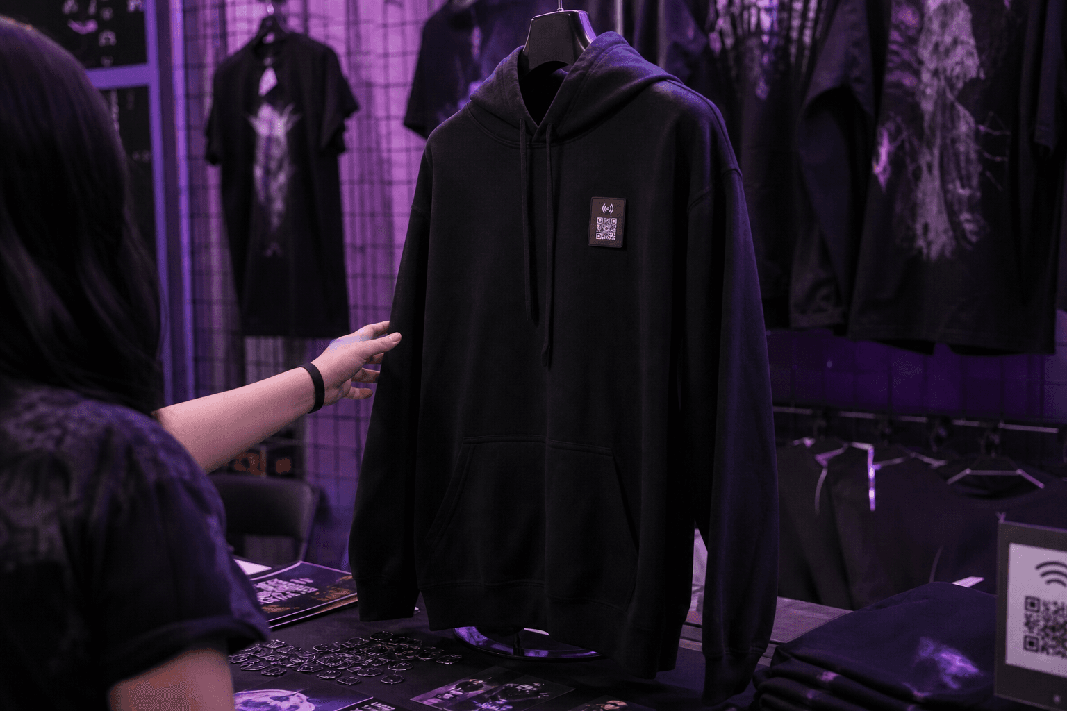 Tour hoodie with LivingTag merch scan at the venue